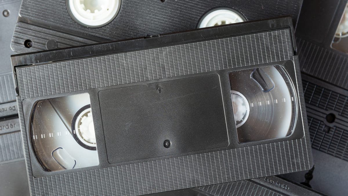 A close-up of old VHS tapes